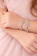 Delicate silver bracelets with pink hearts